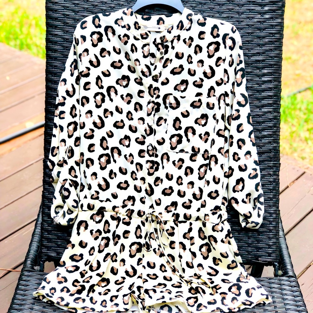 Cheetah print shorts romper. Size medium.